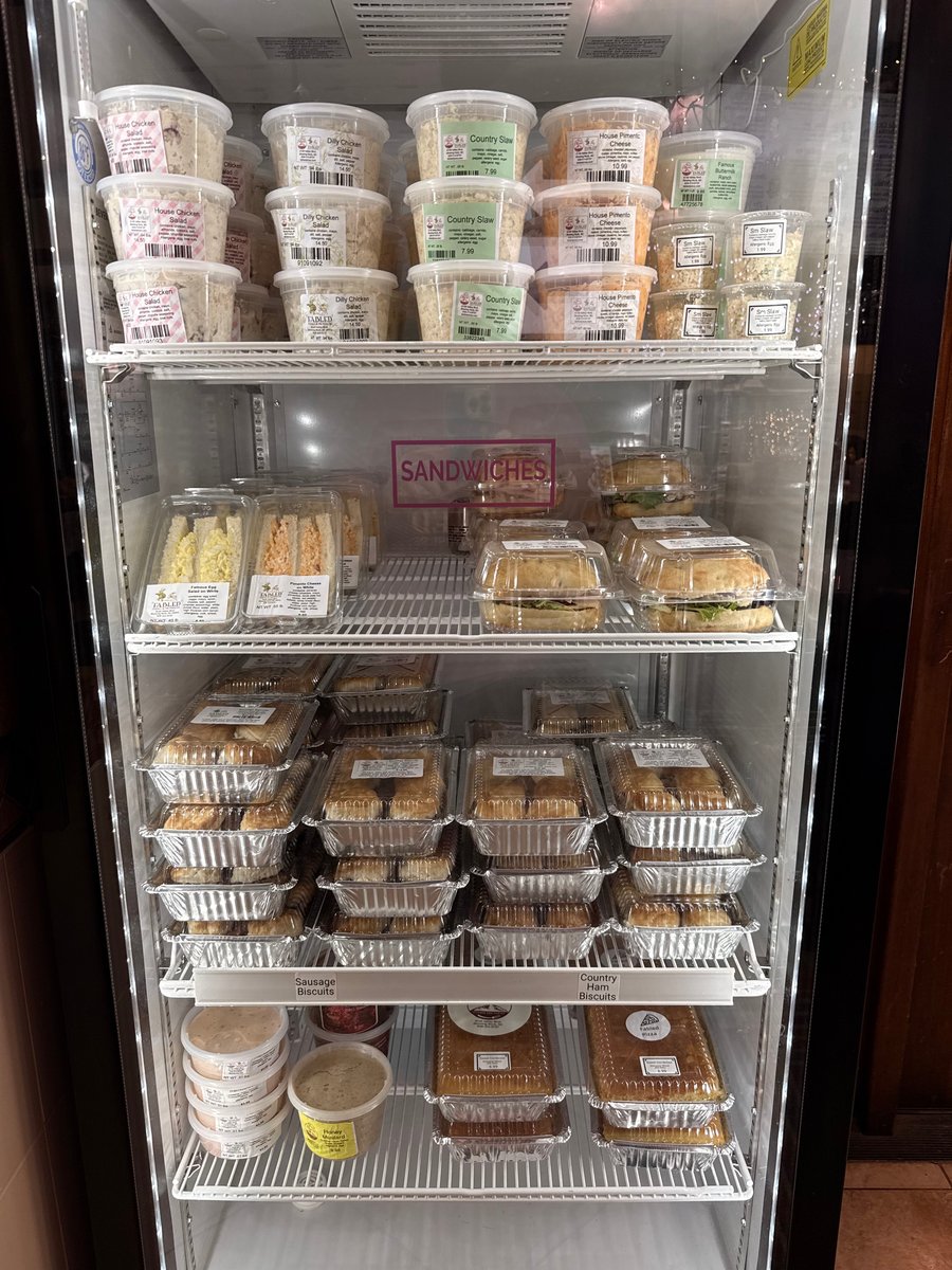 Refrigerator with chicken salads, sandwiches, and prepared meals